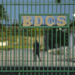 
              A guard is seen through a gate marked with the initials of the Bahamas Department of Correctional Services at Fox Hill prison, where FTX founder Sam Bankman-Fried is being held in Nassau, Bahamas, Monday, Dec. 19, 2022. (AP Photo/Rebecca Blackwell)
            