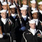 
              A ceremonial U.S. Navy unit marches in before President Joe Biden welcomes French President Emmanuel Macron during a State Arrival Ceremony on the South Lawn of the White House in Washington, Thursday, Dec. 1, 2022. (AP Photo/Patrick Semansky)
            