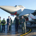 
              Britain's Prime Minister Rishi Sunak centre, speaks to staff during his visit to RAF Coningsby in Lincolnshire, England, Friday, Dec. 9, 2022,  following the announcement that Britain will work to develop next-generation fighter jets with Italy and Japan. (Joe Giddens/Pool Photo via AP)
            