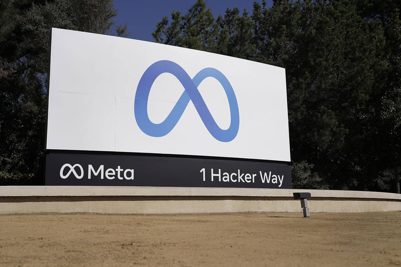 FILE - Facebook's Meta logo sign is seen at the company headquarters in Menlo Park, Calif., on, Oct...