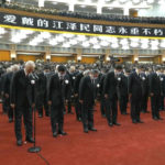 
              In this image taken from video footage run by China's CCTV, Chinese President Xi Jinping leads other officials to bow during a formal memorial for the late former Chinese President Jiang Zemin held at the Great Hall of the People in Beijing on Tuesday, Dec. 6, 2022. Words at top partly reads "Comrade Jiang Zemin Immortal" (CCTV via AP)
            