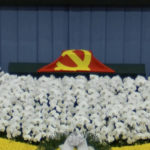 
              In this image taken from video footage run by China's CCTV, a Chinese Communist Party flag covers the cremated remains of late former Chinese President Jiang Zemin during a formal memorial held at the Great Hall of the People in Beijing on Tuesday, Dec. 6, 2022. (CCTV via AP)
            