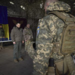 
              In this photo provided by the Ukrainian Presidential Press Office, Ukrainian President Volodymyr Zelenskyy, centre left, stands along servicemen during a minute of silence in honor of soldiers killed during fighting with Russian troops as he visits the Sloviansk, Donbas region, Ukraine, Tuesday, Dec. 6, 2022. (Ukrainian Presidential Press Office via AP)
            