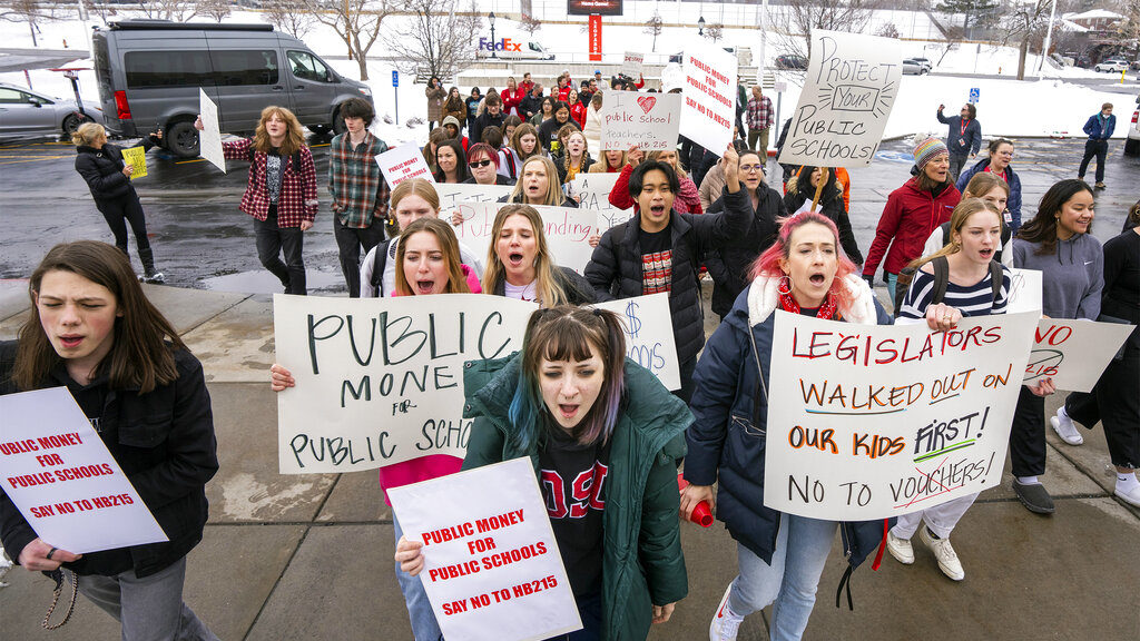 Students and teachers from East High School in Salt Lake City walk out of school to protest the HB1...