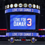 
              A message isdisplay on the jumbotron paying tribute to Buffalo Bills safety Damar Hamlin prior to an NHL hockey game between the Buffalo Sabres and the Minnesota Wild, Saturday, Jan. 7, 2023, in Buffalo, N.Y. (AP Photo/Jeffrey T. Barnes)
            