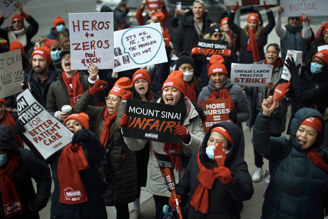 FILE -- Nurses shout slogans during a nursing strike outside Mount Sinai Hospital, Jan. 10, 2023, i...