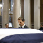 
              Prince Pavlos son of former king of Greece Constantine II stands in front of the coffin during funeral at Metropolitan Cathedral in Athens, Monday, Jan. 16, 2023. Constantine died in a hospital late Tuesday at the age of 82 as Greece's monarchy was definitively abolished in a referendum in December 1974. (Stoyan Nenov/Pool via AP)
            