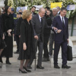 
              Former Spanish King Juan Carlos, center, and Spain's former Queen Sofia, sister of former king of Greece Constantine II arrive at Metropolitan Cathedral for the funeral in Athens, Monday, Jan. 16, 2023. Constantine died in a hospital late Tuesday at the age of 82 as Greece's monarchy was definitively abolished in a referendum in December 1974. (AP Photo/Petros Giannakouris)
            
