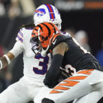 
              Cincinnati Bengals wide receiver Tee Higgins (85) runs near Buffalo Bills safety Damar Hamlin (3) during the first half of an NFL football game, Monday, Jan. 2, 2023, in Cincinnati. Hamlin was injured on the play. The game has been postponed after Buffalo Bills' Damar Hamlin collapsed, NFL Commissioner Roger Goodell announced. (AP Photo/Joshua A. Bickel)
            