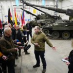 
              Britain's Defence Secretary Ben Wallace speaks to the media during his visit to the Tapa Military Camp, in Estonia, Thursday, Jan. 19, 2023. Wallace said his country would send at least three batteries of AS-90 artillery, armoured vehicles, thousands of rounds of ammunition and 600 Brimstone missiles, as well as the squadron of Challenger 2 tanks. (AP Photo/Pavel Golovkin)
            