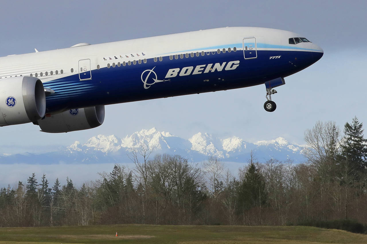 FILE - In this Jan. 25, 2020, file photo a Boeing 777X airplane takes off on its first flight with ...