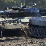
              FILE - A Leopard 2 tank is pictured during a demonstration event held for the media by the German Bundeswehr in Munster near Hannover, Germany, Wednesday, Sept. 28, 2011. Germany faces mounting pressure to supply battle tanks to Kyiv and Ukrainian President Volodymyr Zelenskyy is airing frustration about not obtaining enough weaponry as Western allies confer on how best to support Ukraine nearly 11 months into Russia’s invasion. Germany’s new defense minister welcomed U.S. Defense Secretary Lloyd Austin to Berlin, declaring that German weapons systems delivered so far have proven their worth and that aid will continue in the future. (AP Photo/Michael Sohn, File)
            
