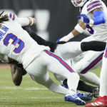 
              Cincinnati Bengals wide receiver Tee Higgins (85) collides with Buffalo Bills safety Damar Hamlin (3) during the first half of an NFL football game, Monday, Jan. 2, 2023, in Cincinnati. Hamlin was injured on the play. Tonight's Buffalo Bills-Cincinnati Bengals game has been postponed after Buffalo Bills' Damar Hamlin collapsed, NFL Commissioner Roger Goodell announced. (AP Photo/Joshua A. Bickel)
            