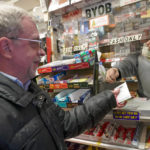 
              A customer buys a chance at the $940 million Mega Millions Lottery jackpot at a convenience store on the Upper East Side of Manhattan, Friday, Jan. 6, 2023 in New York. (AP Photo/Mary Altaffer)
            