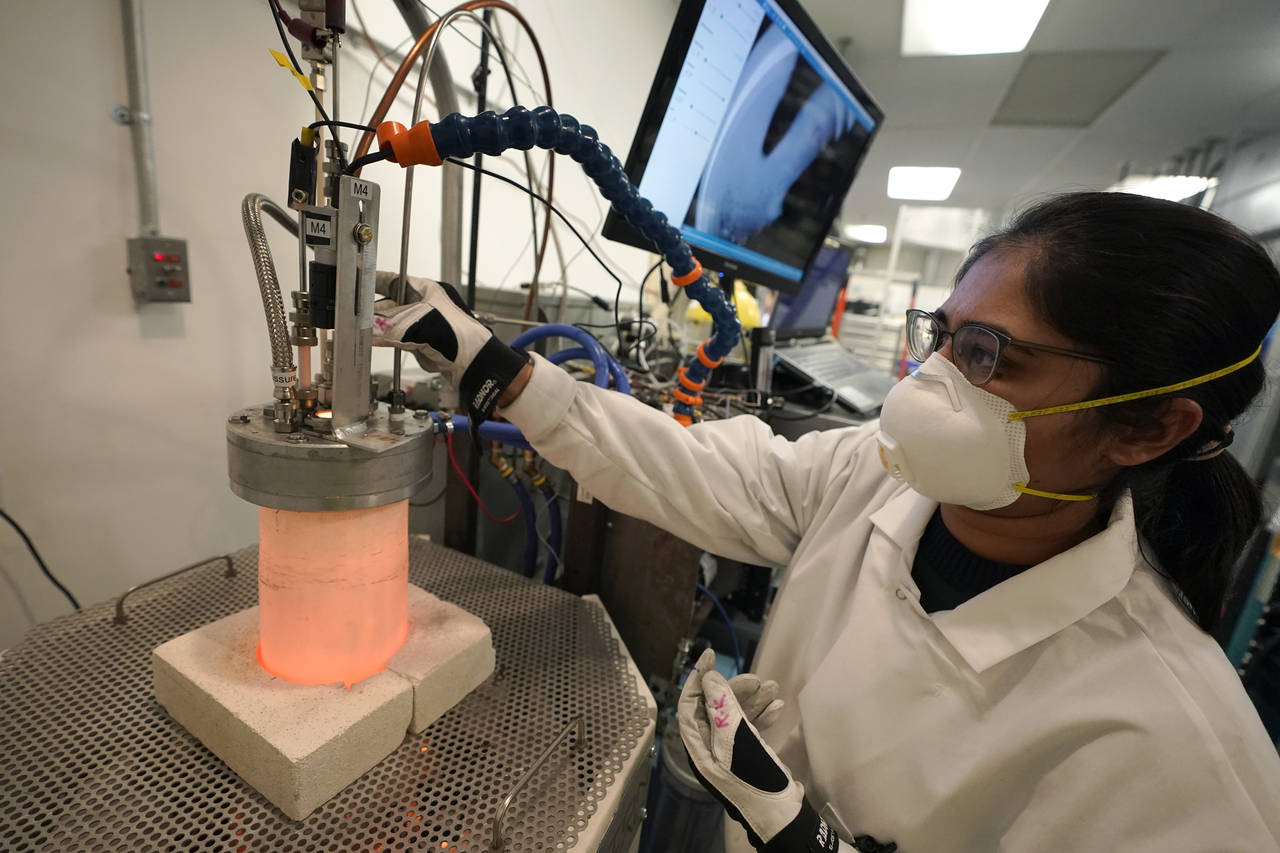 Research and development engineer Ravneet Kailey performs an experiment to produce steel without us...
