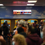 
              People wait in line at "The Lotto Store at Primm" just inside the California border Friday, Jan. 13, 2023, near Primm, Nev. Mega Millions players will have another chance Friday night to end months of losing and finally win a jackpot that has grown to $1.35 billion. (AP Photo/John Locher)
            