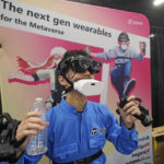 
              The "mutalk" leakage voice suppression microphone is demonstrated with the Megane X, an ultra-lightweight and ultra-compact VR headset and the Flip VR, a hand controller at the Shiftall booth during CES Unveiled, before the CES tech show, Tuesday, Jan. 3, 2023, in Las Vegas. (AP Photo/Rick Bowmer)
            