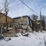 
              Buildings impacted by Russian missile shelling are seen in Kyiv, Ukraine, Wednesday, Jan. 11, 2023. (AP Photo/Andrew Kravchenko)
            