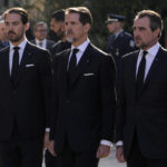 
              Prince Philippos, left, Prince Pavlos, center, and Prince Pavlos, right, sons of former king of Greece Constantine II stand behind their father coffin as they arrive at the Metropolitan cathedral for his funeral in Athens, Monday, Jan. 16, 2023. Constantine died in a hospital late Tuesday at the age of 82 as Greece's monarchy was definitively abolished in a referendum in December 1974. (AP Photo/Petros Giannakouris)
            