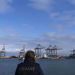 
              A Dutch customs officer poses for the media as containers are being unloaded at the Maasvlakte container terminal location in the port of Rotterdam, Netherlands, Monday, Jan. 9, 2023. Cocaine is spreading at an alarming rate through Europe, much of it through the world ports of Antwerp and Rotterdam. And a Tuesday, Jan. 10. 2023, announcement of massive seizures may well hide a bigger truth, that South American cartels are throwing ever more cocaine at the European market. (AP Photo/Peter Dejong)
            