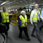 
              U.S. Treasury Secretary Janet Yellen, left, walks with Ockert Berry, second from right, and Neale Hill during her tour at the Ford Assembling Plant in Pretoria, South Africa, Thursday, Jan. 26, 2023. (AP Photo/Themba Hadebe)
            