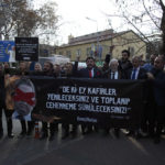 
              Protesters carry a banner with a crossed-out picture of Swedish politician Rasmus Paludan and a Quranic verse reading "Say this: Oh non-believers, you will be defeated and you shall be gathered and exiled unto hell" during a demonstration outside the Swedish embassy in Ankara, Turkey, Saturday, Jan. 21, 2023. Far-right activist Paludan has received permission from police to stage a protest outside the Turkish Embassy in Stockholm, where he intends to burn the Quran, Islam's holy book. (AP Photo/Burhan Ozbilici)
            