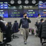 Currency traders work at the foreign exchange dealing room of the KEB Hana Bank headquarters in Seoul, South Korea, Monday, Jan. 30, 2023. Shares were trading mixed in Asia on Monday after Wall Street benchmarks closed higher on Friday, capping a third week of gains out of the last four. (AP Photo/Ahn Young-joon)