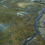 
              This Sept. 2011 aerial photo provided by the Environmental Protection Agency, shows the Bristol Bay watershed in Alaska. The U.S. Environmental Protection Agency on Tuesday, Jan. 31, 2023, effectively vetoed a proposed copper and gold mine in the remote region of southwest Alaska that is coveted by mining interests but that also supports the world's largest sockeye salmon fishery. (Joseph Ebersole/EPA via AP)
            