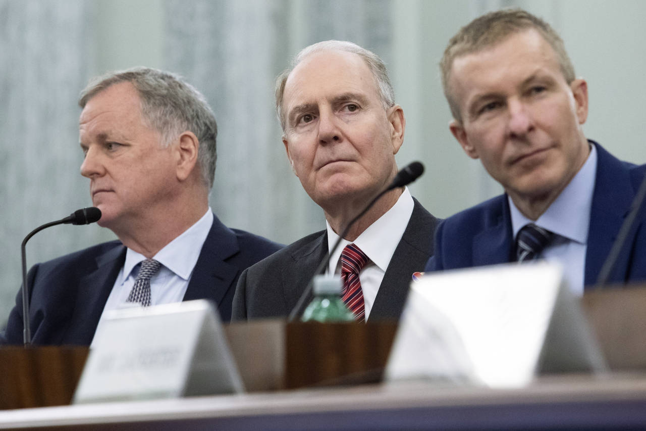 FILE - From left, American Airlines CEO Doug Parker, Southwest Airlines CEO Gary Kelly and United A...