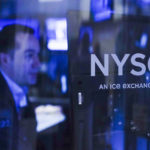 
              FILE - Traders work on the floor at the New York Stock Exchange in New York, Tuesday, Oct. 4, 2022. (AP Photo/Seth Wenig, File)
            