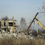 
              Workers clean rubbles after Ukrainian rocket strike in Makiivka, in Russian-controlled Donetsk region, eastern Ukraine, Tuesday, Jan. 3, 2023. Russia's defense ministry says 63 of its soldiers have been killed by a Ukrainian strike on a facility in the eastern Donetsk region where military personnel were stationed. (AP Photo)
            