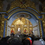 
              People attend the Christmas service in the Assumption Cathedral in Lavra, the Monastery of the Caves, Kyiv, Ukraine, Saturday, Jan. 7, 2023. Saturday service was conducted by Ukrainian patriarchate for the first time after Lavra had been under Russia's influence for hundreds of years and was subordinated to Russia. (AP Photo/Efrem Lukatsky)
            