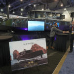 
              The NAVIER 30 is shown at the NAVIER booth during the CES tech show Friday, Jan. 6, 2023, in Las Vegas. The NAVIER 30 is the world's longest range electric hydrofoil boat. It flies 4.5 feet above the water. The NAVIER 30 is 10 times more efficient than a traditional gas boat. (AP Photo/Rick Bowmer)
            