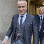 
              Fashion designer Thom Browne leaves Manhattan federal court, Thursday, Jan. 12, 2023, in New York,  after a jury decided he did not infringe the trademark of sportswear giant Adidas. (AP Photo/Larry Neumeister)
            