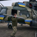 
              A soldier loads the weapon in a helicopter at a Ukrainian military air base close to the frontline in the Kherson region, Ukraine, Sunday, Jan. 8, 2023. (AP Photo/LIBKOS)
            