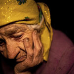 
              Nina Gonchar, 93, sits in her house which was mostly destroyed by Russian forces in the recently retaken village of Bogorodychne, Ukraine, Saturday, Jan. 7, 2022. Gonchar's son Vasyliy and his wife Liubov were killed by Russian shelling on July 10, 2022. (AP Photo/Evgeniy Maloletka)
            