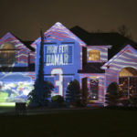 
              A projection showing support for Buffalo Bills safety Damar Hamlin is seen on Michael and Shauna Karas' house Friday, Jan. 6, 2023, in Lancaster, N.Y. Hamlin is now breathing and walking on his own, and traded in the writing pad he had been using to communicate. (AP Photo/Joshua Bessex)
            