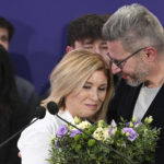 
              Czech Presidential candidate Danuse Nerudova and her husband Robert Neruda attend a press conference after announcement of the preliminary results for the first round of presidential election in Prague, Czech Republic, Saturday, Jan. 14, 2023. (Michal Kamaryt/CTK via AP)
            