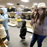 
              Irene Schaefer, of Johnson Creek, Wis., shops for hats at Longhorn Saddlery in Dubuque, Iowa, on Friday, Dec. 30, 2022. On Wednesday, the Commerce Department releases U.S. retail sales data for December. (Jessica Reilly/Telegraph Herald via AP)
            