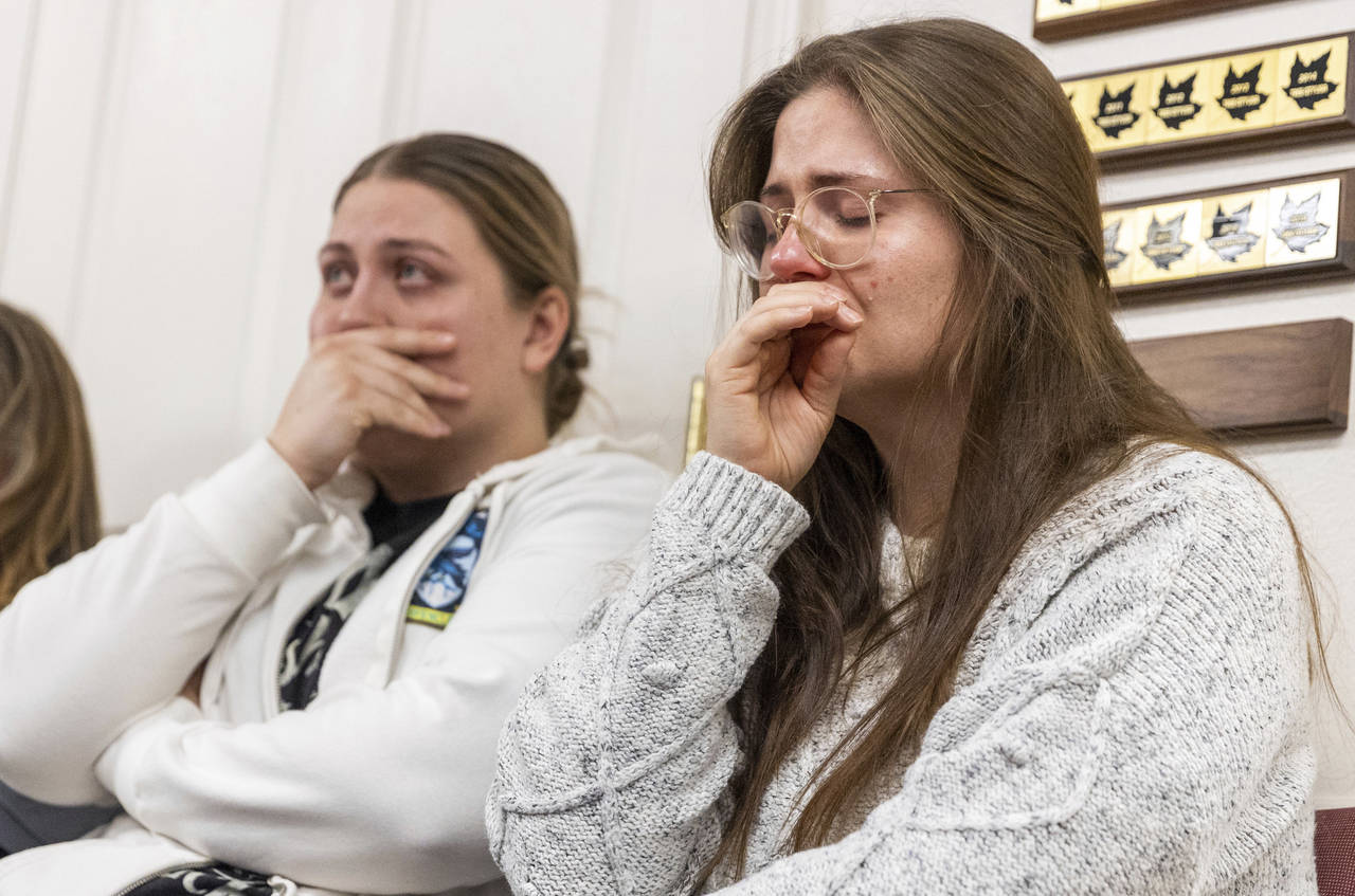 Jess, left, sits next to her sister, Cecily, during a press conference regarding the killing of a f...