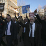 
              Protesters chant slogans during a demonstration outside the Swedish embassy in Ankara, Turkey, Saturday, Jan. 21, 2023. Far-right activist Rasmus Paludan has received permission from police to stage a protest outside the Turkish Embassy in Stockholm, where he intends to burn the Quran, Islam's holy book. (AP Photo/Burhan Ozbilici)
            