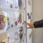 
              CORRECTS THE PHOTOGRAPHER'S NAME TO KWIYEON HA - A customer purchases whale meat from a vending machine at Kyodo Senpaku's unmanned store, Thursday, Jan. 26, 2023, in Yokohama, Japan. The Japanese whaling operator, after struggling for years to promote its controversial products, has found a new way to cultivate clientele and bolster sales: whale meat vending machines. (AP Photo/Kwiyeon Ha)
            