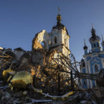 
              A cupola lies on the ground in front of the Orthodox Church which was destroyed by Russian forces in the recently retaken village of Bogorodychne, Ukraine, Saturday, Jan. 7, 2022. (AP Photo/Evgeniy Maloletka)
            