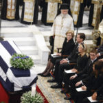 
              Greece's former Queen Anne Marie, former Crown Prince Pavlos and Princess Marie-Chantal, seen first row, former Spanish King Juan Carlos and Queen Sofia, second row, attend the funeral service of former king of Greece Constantine II at Metropolitan Cathedral in Athens, Monday, Jan. 16, 2023. Constantine died in a hospital late Tuesday at the age of 82 as Greece's monarchy was definitively abolished in a referendum in December 1974. (Stoyan Nenov/Pool via AP)
            