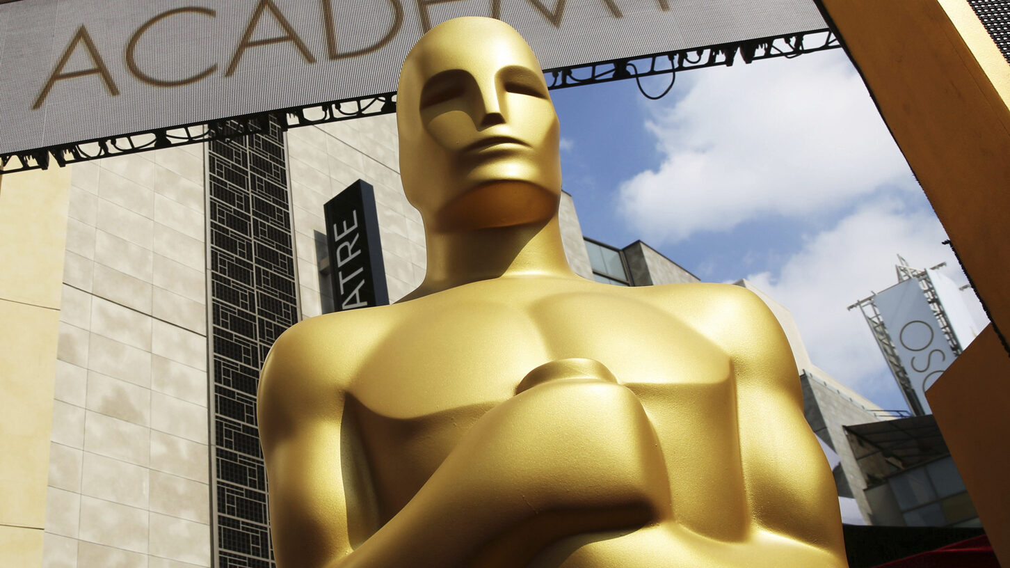 FILE - In this Feb. 21, 2015 file photo, an Oscar statue appears outside the Dolby Theatre for the ...