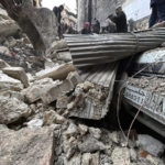 
              Syrian Civil Defense workers and security forces search through the wreckage of collapsed buildings, in Aleppo, Syria, Monday, Feb. 6, 2023. A powerful earthquake rocked wide swaths of Turkey and neighboring Syria on Monday, toppling hundreds of buildings and killing and injuring thousands of people. (AP Photo/Omar Sanadiki)
            