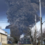 
              A black plume rises over East Palestine, Ohio, as a result of a controlled detonation of a portion of the derailed Norfolk and Southern trains Monday, Feb. 6, 2023. (AP Photo/Gene J. Puskar)
            