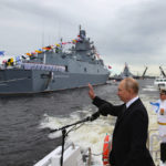 
              Russian President Vladimir Putin, center, and Defense Minister Sergei Shoigu, right, review warships before the main naval parade marking Russian Navy Day in the Gulf of Finland, at St. Petersburg, Russia, on Sunday, July 31, 2022. Putin sent Russian forces into Ukraine on Feb. 24, 2022, and appears determined to prevail -- ruthlessly and at all costs. (Mikhail Klimentyev, Sputnik, Kremlin Pool Photo via AP, File)
            