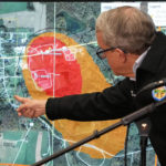 
              Ohio Governor Mike DeWine points to a map of East Palestine, Ohio that indicates the area that has been evacuated as a result of Norfolk Southern train derailment, after touring the site, Monday, Feb. 6, 2023, in East Palestine, Ohio. (AP Photo/Gene J. Puskar)
            