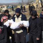 
              Mourners bury family members who died in a devastating earthquake that rocked Syria and Turkey at a cemetery in the town of Jinderis, Aleppo province, Syria, Tuesday, Feb. 7, 2023.  A newborn girl was found buried under debris with her umbilical cord still connected to her mother, Afraa Abu Hadiya, who was found dead, according to relatives and a doctor.  The baby was the only member of her family to survive from the building collapse Monday in  Jinderis, next to the Turkish border, Ramadan Sleiman, a relative, told The Associated Press. (AP Photo/Ghaith Alsayed)
            